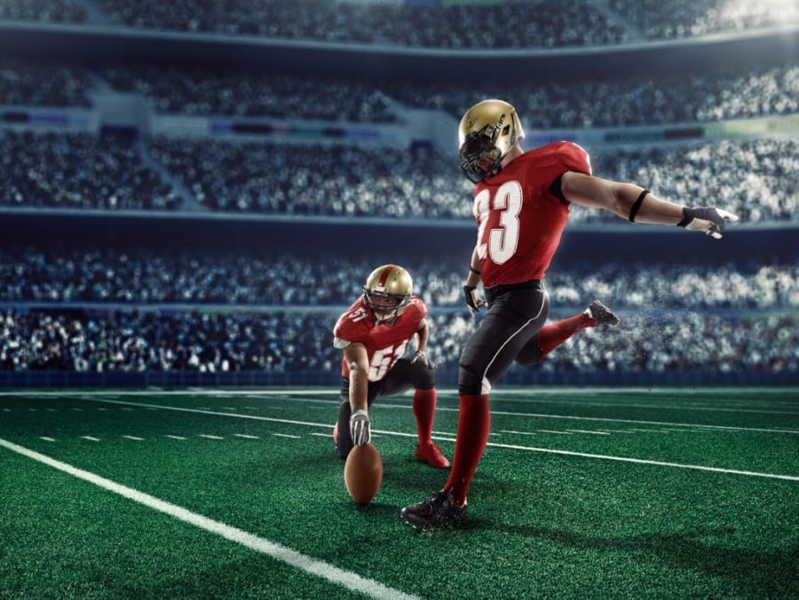 American footballer attempting field goal American footballer attempting field goal