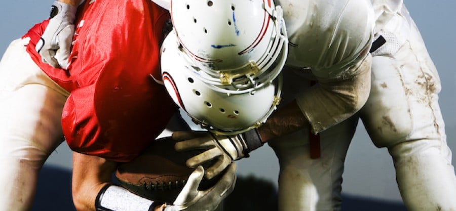 American Football players tackling American Football players tackling