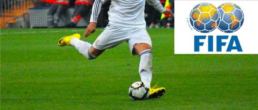 Football Kicked and FIFA Logo Football Kicked and FIFA Logo