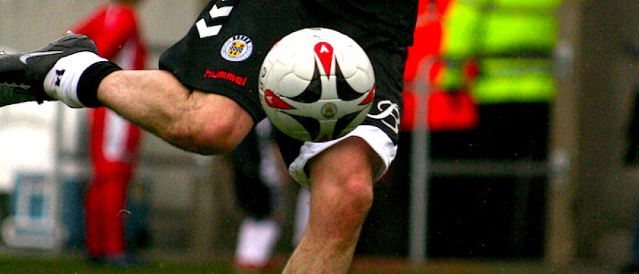 Football about to be kicked Football about to be kicked