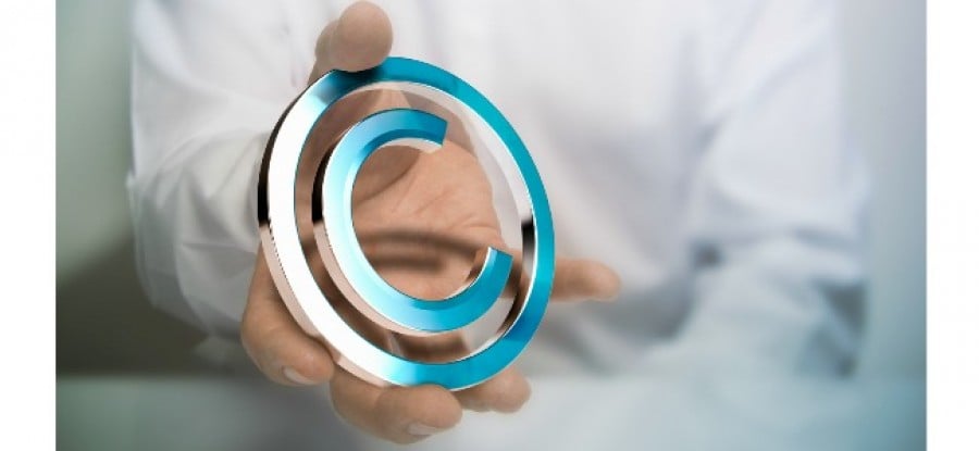 Man_holding_Copyright_Symbol Man_holding_Copyright_Symbol