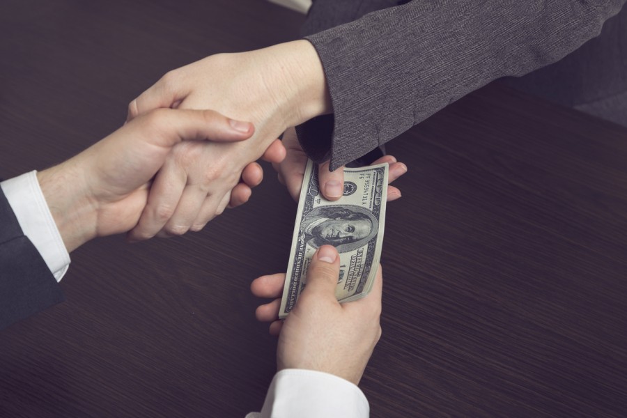 Shaking hands and passing money Shaking hands and passing money