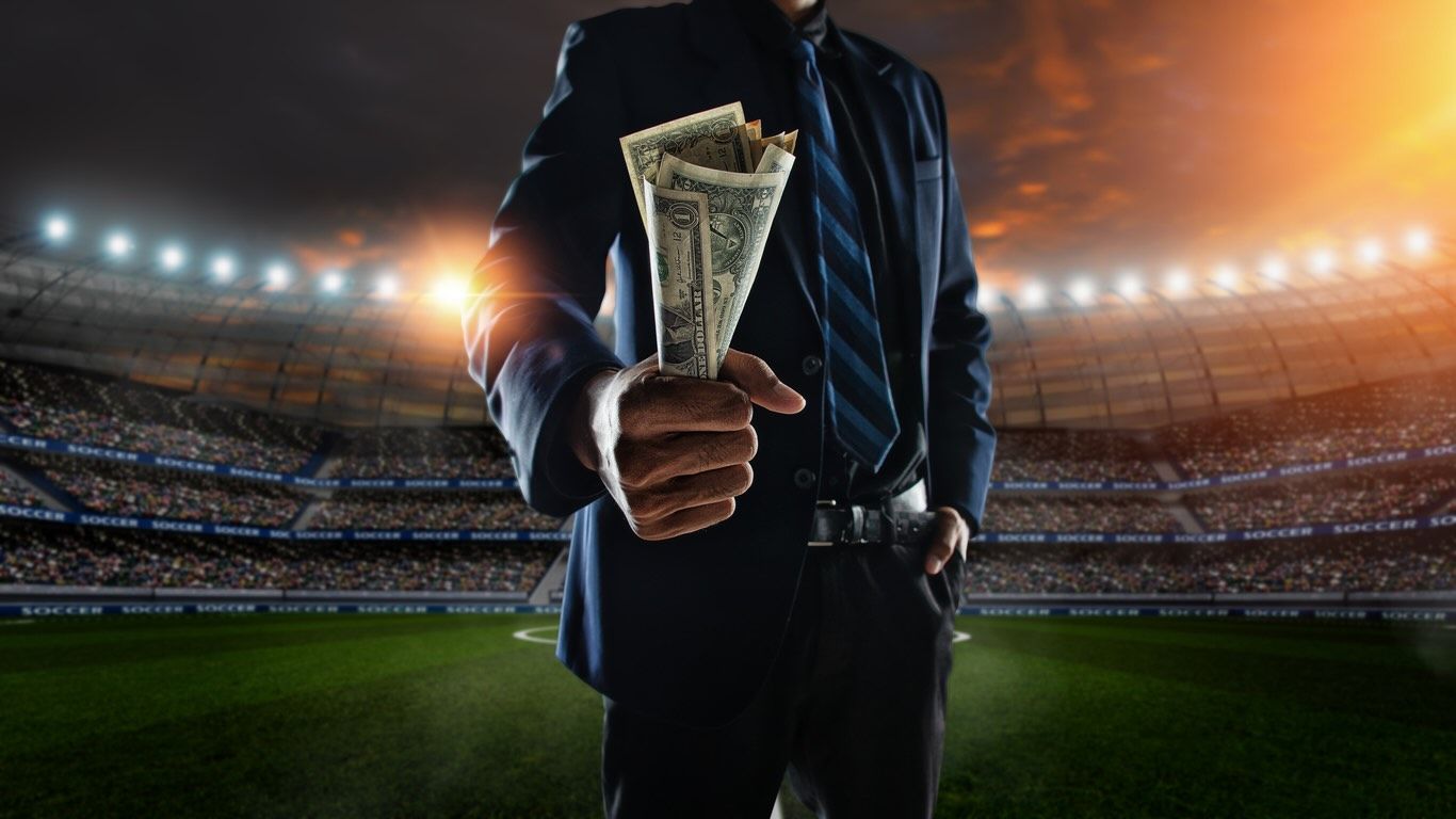 Business person holding cash