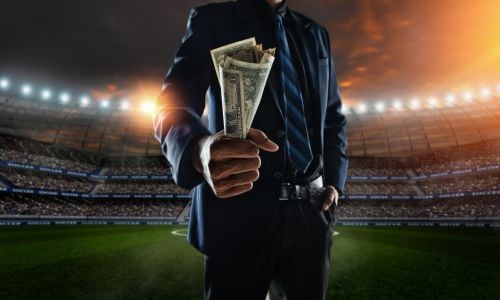 Business person holding cash