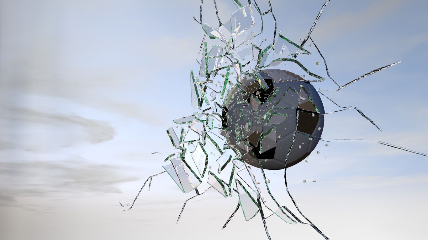 Football cracking glass