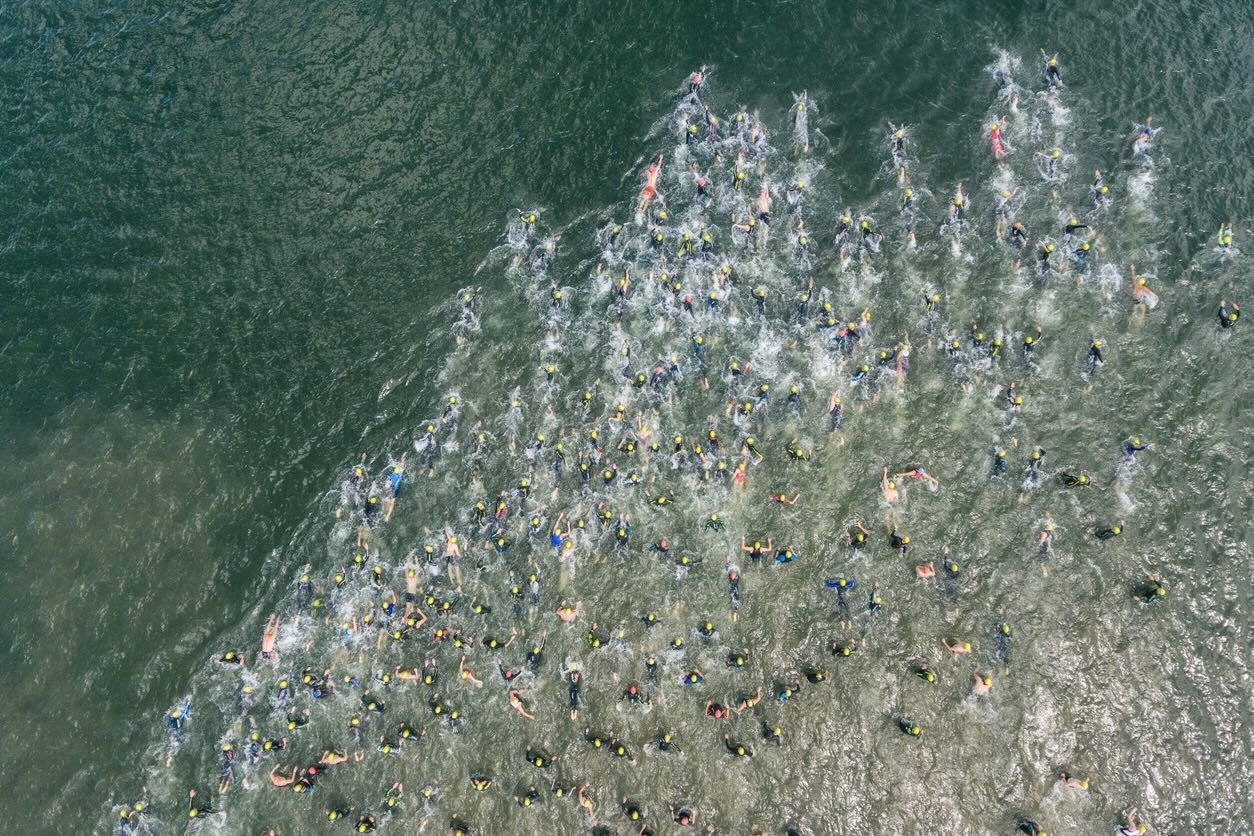 Triathlon participants swimming