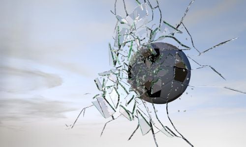 Football cracking glass