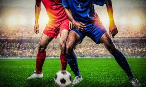 Two Footballers Tackling