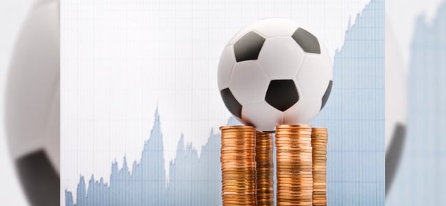 Football on coin stack