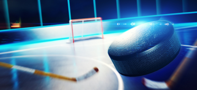 Ice hockey game from viewpoint of puck 