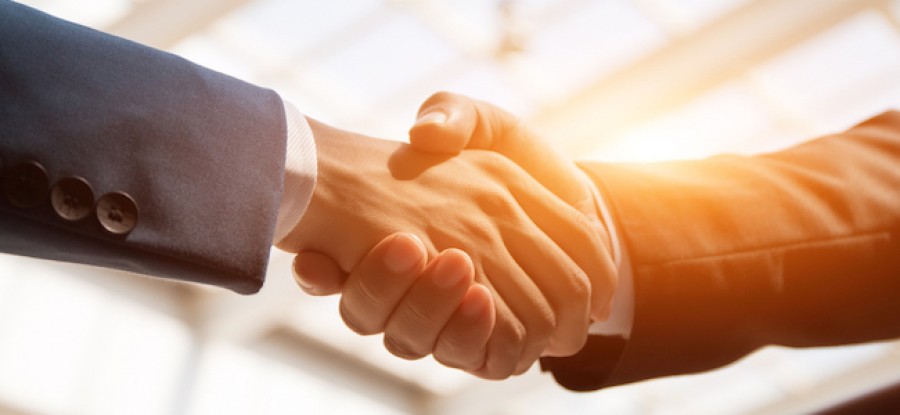 Handshake with sunlight in the background