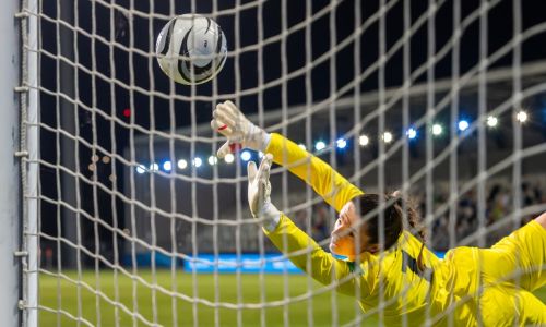 Women goalkeeper saving shot