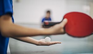 Table Tennis Player Holding Ball