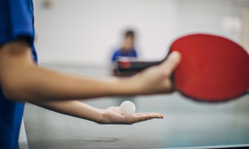 Table Tennis Player Holding Ball
