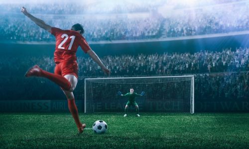 Title image of footballer taking shot at goal