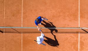 Two Tennis Players Greeting Each Other Over the Net