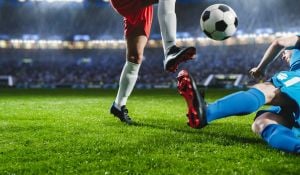 Footballer Tackling
