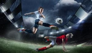 Female Footballer Tackling