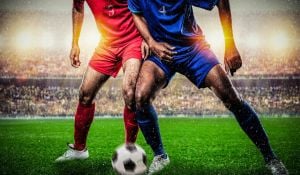 Two Footballers Tackling